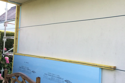 Pose d'un bardage bois extérieur avec isolant sur habitation